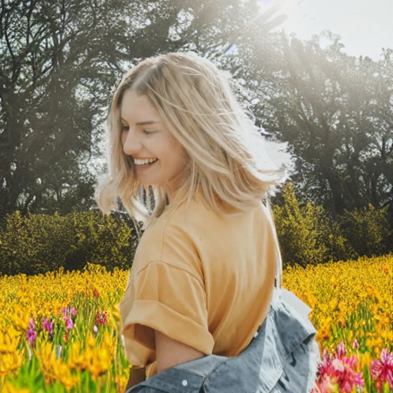 The same woman in a field of flowers