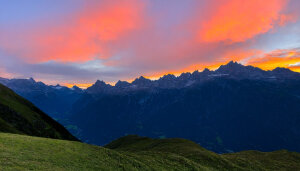Sunrise over a mountain range in the alpes